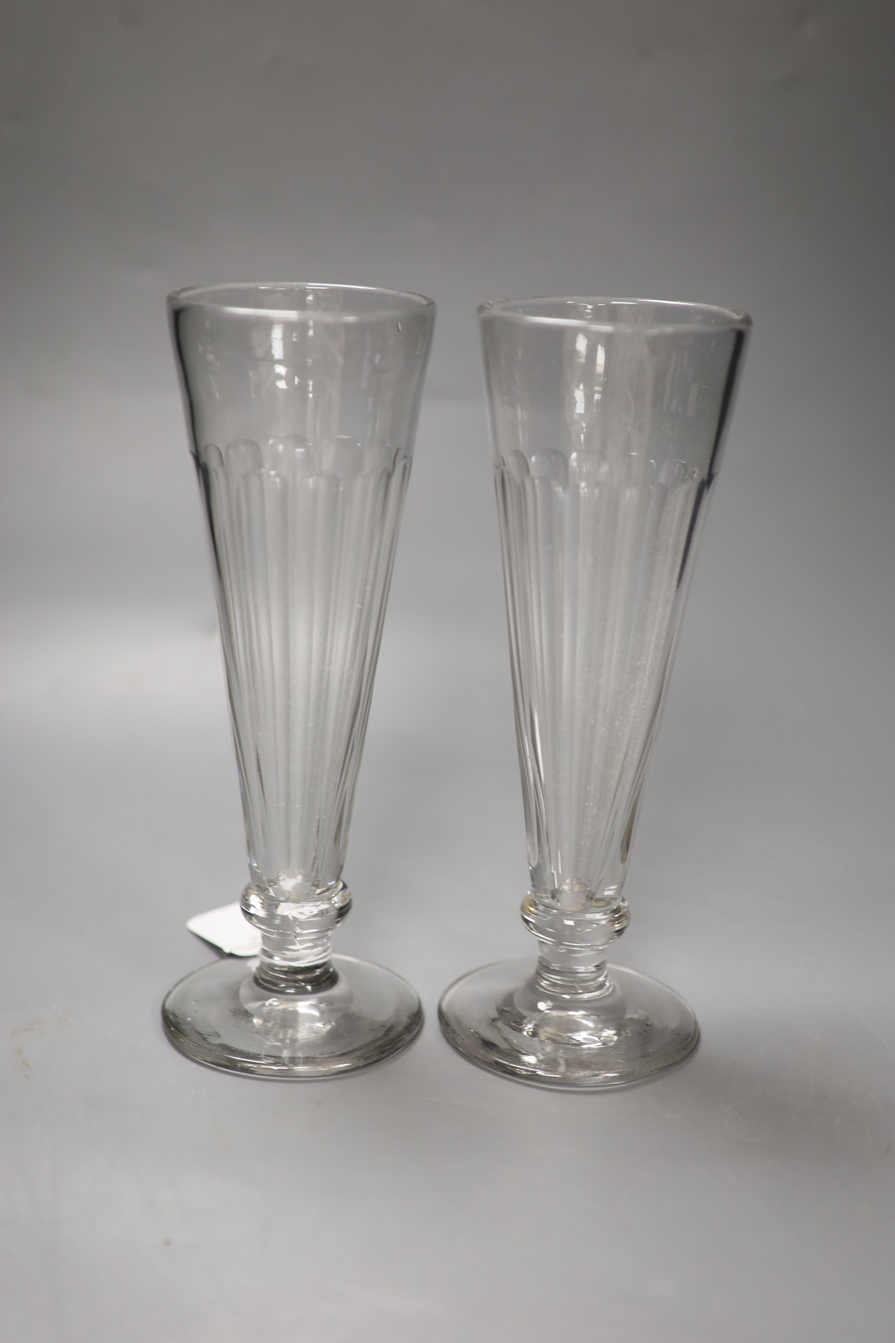 A pair of panel-cut ale flutes, 24cm high and a Beswick bay stallion